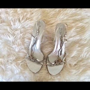 Ladies open toe silver sandals with black heels